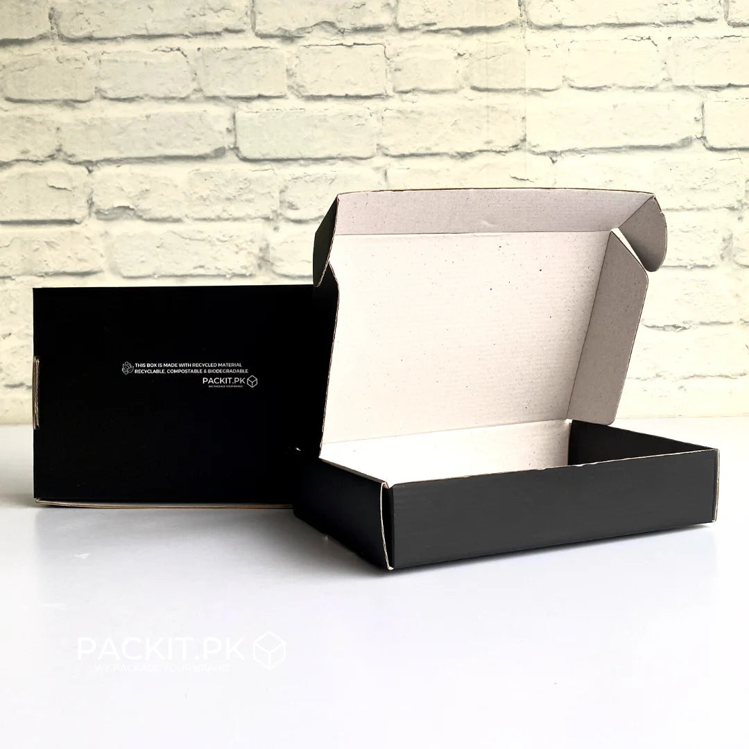 black shipping boxes with logo